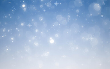 Winter snowfall and snowflakes on light blue background.blue bokeh abstract light backgrounds