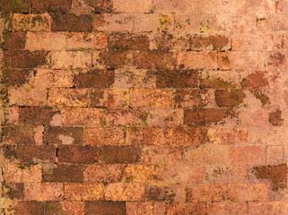Random pattern brown color natural clay brick on wall background