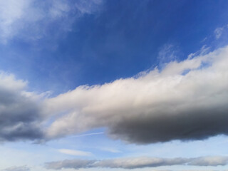 Beautiful white fluffy cloudy sky background,