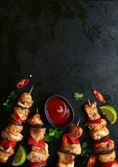 Roasted chicken kebab with ketchup. Top view with copy space.