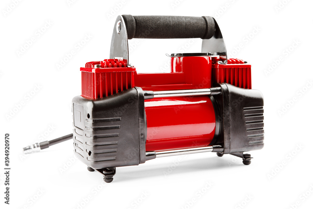 Wall mural car compressor isolated on white background. Electric pump inflates a car wheel