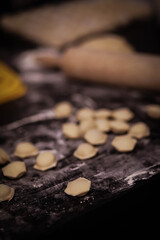 modeling dumplings, homemade dumplings, cooking dumplings from dough and minced meat, flour and rolling pin on the table
