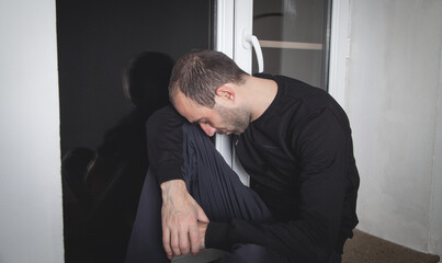 Caucasian sad and depressed man at home.