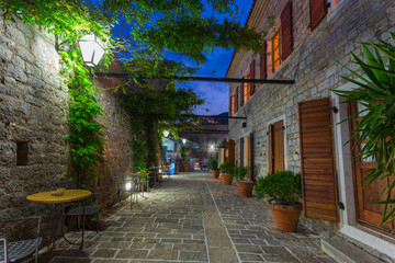 Fototapeta na wymiar Narrow streets of the old evening Budva in Montenegro
