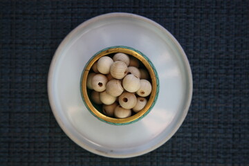 Wooden beads on a gray background.