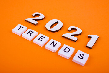 Wooden blocks with the word Trends and wooden numbers 2021. Popular , relevant topics. New trends...