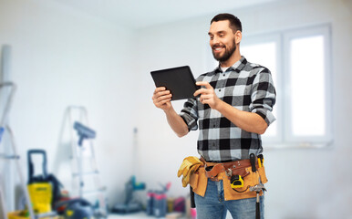technology, construction and repair concept - happy smiling worker or builder with tablet pc...