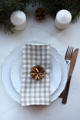 New Year's festive table setting, cutlery, decorations for the New Year's.