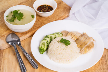 Chicken rice on the wooden table.