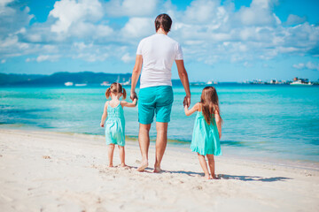 Happy beautiful family on a tropical beach vacation