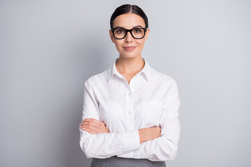 Photo of self-assured business lady crossed hands look camera wear glasses white shirt isolated...