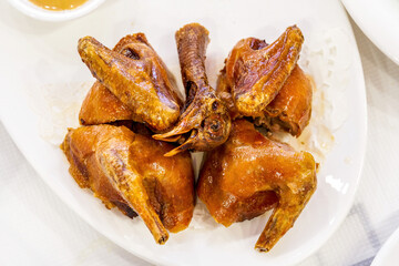 A classic Cantonese dish, braised pigeon, fried pigeon