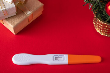 Positive pregnancy test. Christmas gift. Copy space