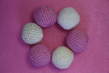 Beads on a pink background.