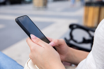 woman hand phone in street