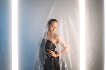 Covid-19 fashion. Pandemic self isolation. Stay safe. Social distancing. Sensual woman in black...
