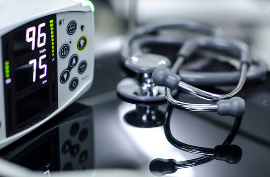 Close-up Of Stethoscope And Monitoring Equipment On Table