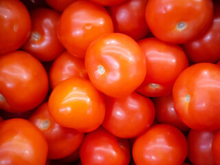 Ripe bright tomatoes close-up. Harvest concept.