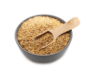Golden linseed, linen seeds in porcelain bowl with wooden spoon isolated on white background