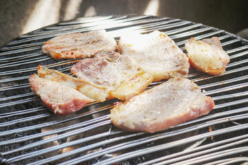 The smell of grilled pork fills in the morning.