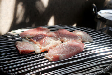 Pork is roasting on the stove clay.