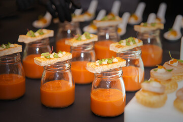 cracker on glass of dipping sauce for party canepe