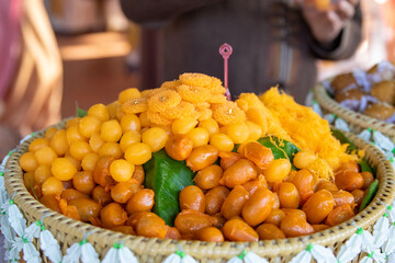 Thong Yod and Thong-ek are placed on banana leaves in Khan Tok.
