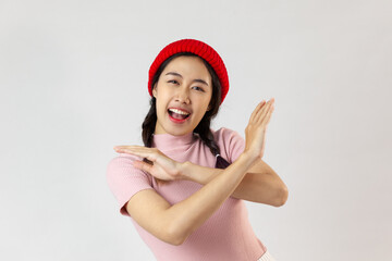portrait happy asian young woman confident holding two crossing arms say no on white background