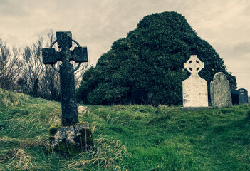 Ireland celtic cross at medieval church cemetery
Old spooky cemetery . Haunted cemetery. Scary...