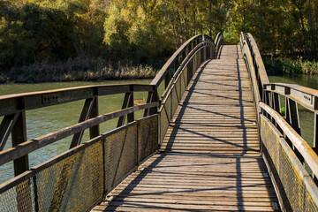 Wooden bridge over a river.