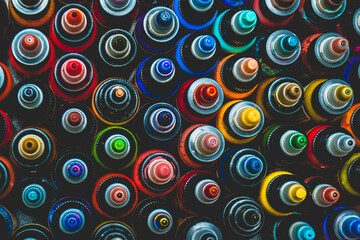 Many bottles with colorful inks for tattoo, close up view