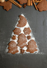 Christmas gingerbread and cinnamon on ardesia place for text at the bottom, vertical position