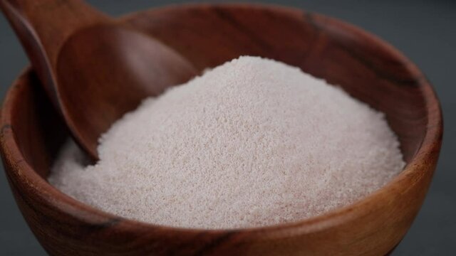 collagen. collagen powder in wooden bowl. Stylish video with collagen. Natural beauty and health supplement