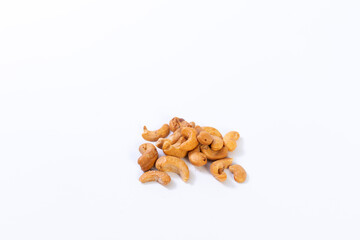 Cashew isolated on white background. Pile of Cashews nuts without shell closeup.