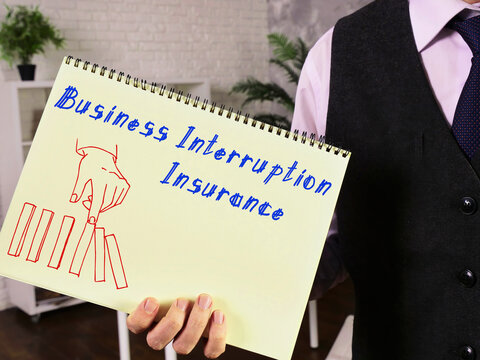 Conceptual photo about Business Interruption Insurance with handwritten text.