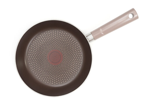 Empty frying pan close up isolated on white background