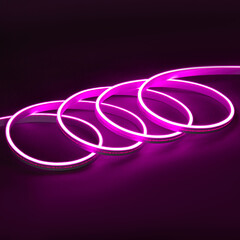 Purple glowing LED neon flex strip on black dark background