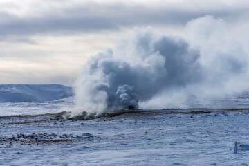 Winter landscape view of the geothermal region Hverir near Myvatn Lake in Iceland. A geothermal area with boiling mud pools and steaming fumaroles Hverir near Myvatn Lake in Iceland.