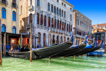 Fototapeta na wymiar Gondolas in Venetian Canal in Venice, Italy