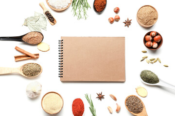 Fototapeta na wymiar Empty notebook among various spices on white background