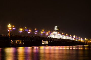 Fototapeta na wymiar bridge over the river at night in capital of Latvia Riga