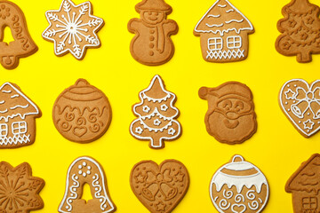 Flat lay with tasty Christmas cookie on yellow  background