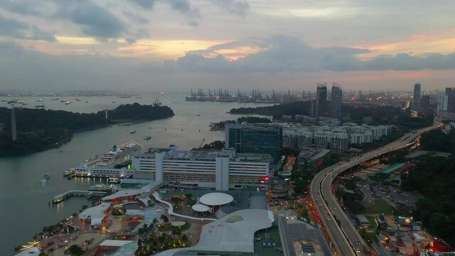 sunset illumination singapore famous city mall sentosa area traffic road aerial panorama 4k 