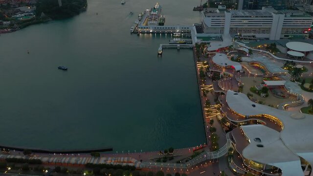twilight illuminated singapore famous city mall sentosa traffic road aerial topdown panorama 4k 