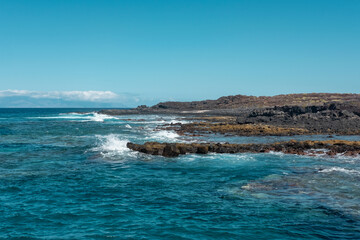 Sunny day at the Natural Reserve of Malpais de la Rasca, views of a popular walk through the volcanic lands once used for agriculture and sea salt harvesting, Palm Mar, Tenerife, Canary Islands, Spain