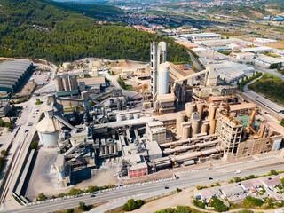 Aerial view of a huge cement plant with warehouses in Catalonia, Spain