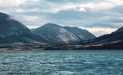 lake with small waves and mountains in New Zealand