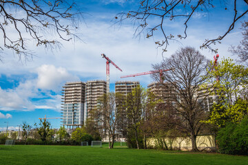 Construction sites of residential buildings seen from Schweizergarten park in Vienna city, Austria