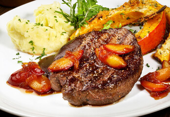Grilled Deer Steak with smashed Potato, roasted Pumpkin and caramelized Apricots