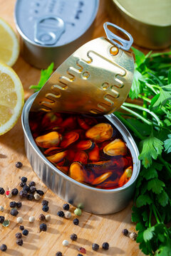 Image of deliciously pickled mussels with lemon and greens, nobody
